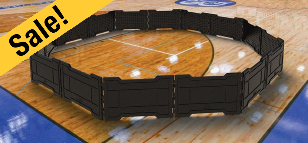 Black gaga ball pit on wooden gymnasium floor